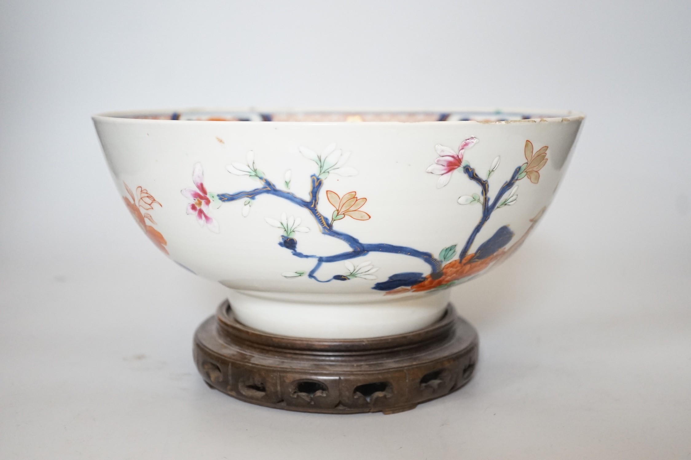 An 18th century Chinese famille rose bowl on wood stand, c.1740, diameter 26cm